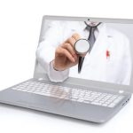 Telemedicine concept. Doctor with a stethoscope on the computer laptop screen.
