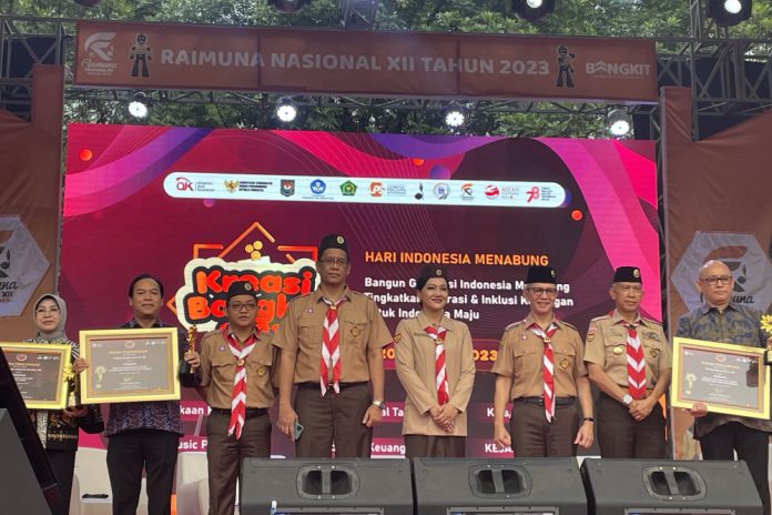 OJK dalam peringatan Hari Indonesia Menabung 2023 yang digelar bersamaan dengan kegiatan Pramuka Raimuna Nasional XII 2023 di Bumi Perkemahan dan Graha Wisata Pramuka (Buperta) Cibubur, Jawa Barat