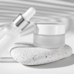 front-view-skin-oil-droppers-face-cream-recipients-composition_23-2148761454