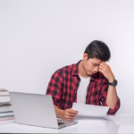 man-using-laptop-office-doing-document-analysis_1150-26846