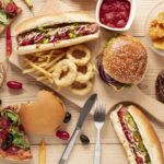 top-view-arrangement-with-food-wooden-background